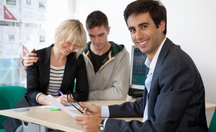 Couple visiting estate agents office