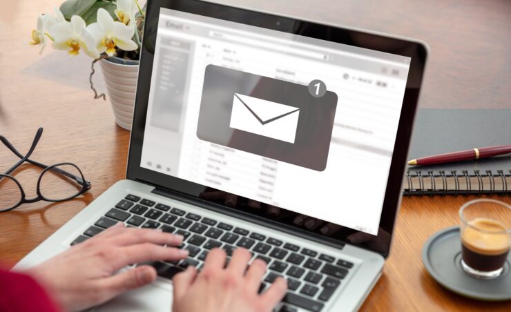 Email notification, woman hand on the computer laptop, one new inbox e mail message on the screen