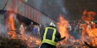 firefighter firefighter fights flames on industrie - horror concept